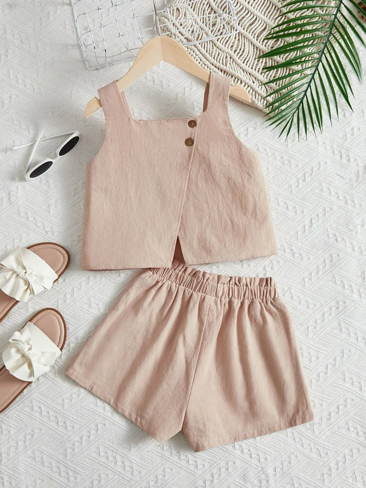 Minimalist baby girl tops in soft, neutral shades