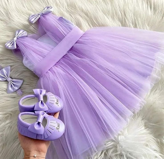 Lavender party dress for baby girl with satin bows and matching shoes
