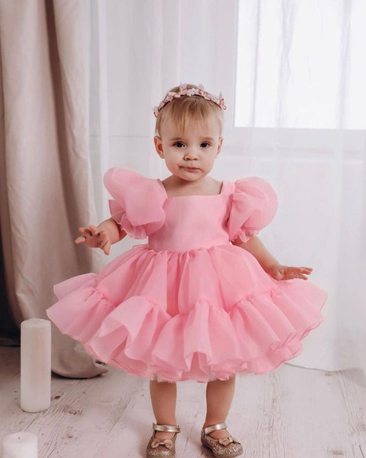 Girl wearing pastel purple fairy-style dress
