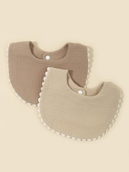 Stylish cotton baby bibs with lace edge detailing

