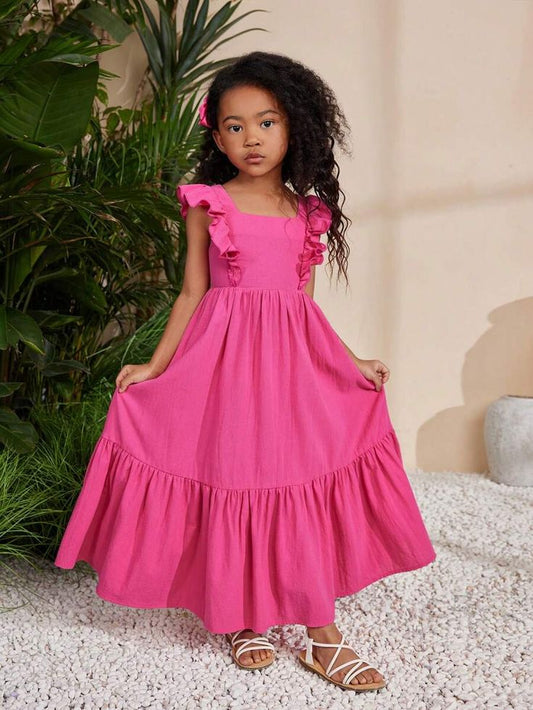 Girl wearing hot pink ruffle maxi dress

