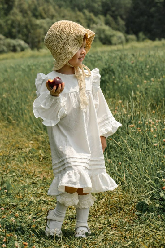 White cotton dress with ruffles for baby girls
