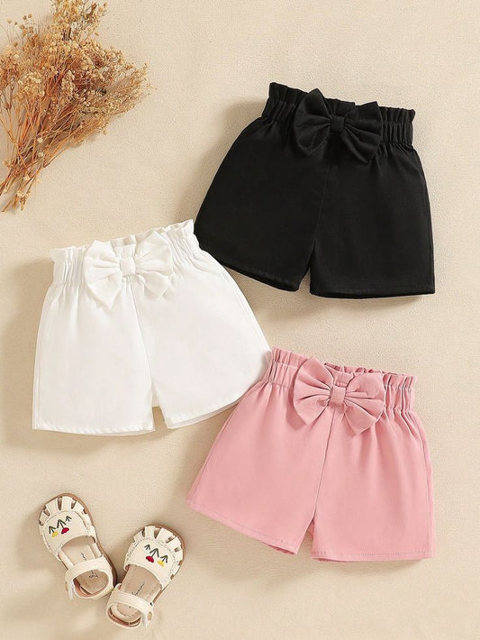Girls’ cotton shorts with bows in black, white, and pink