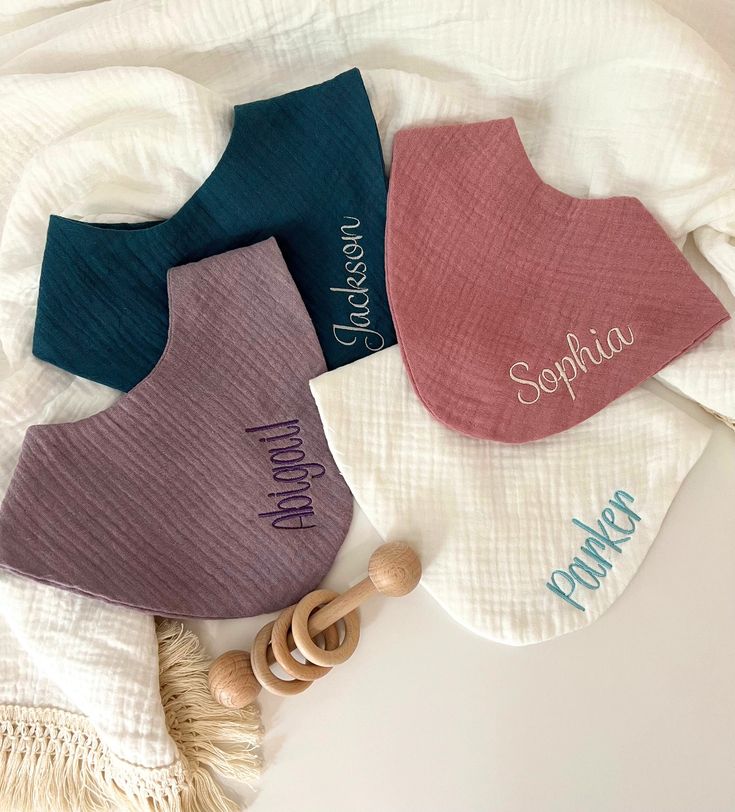 Personalized muslin baby bibs with embroidered names
