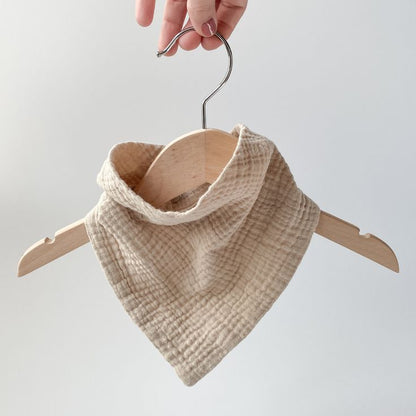Cotton muslin drool bib on kids hanger


