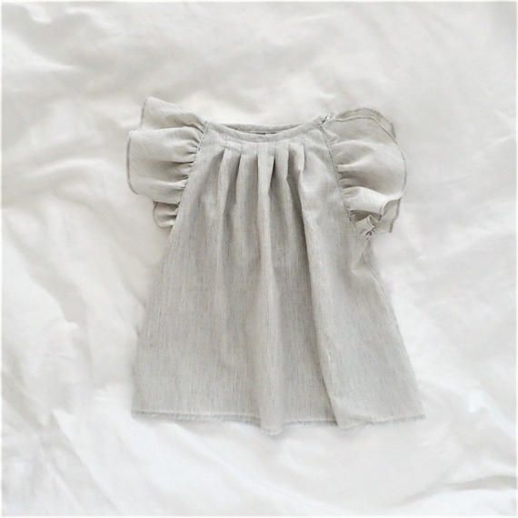 one in light grey and the other in off-white