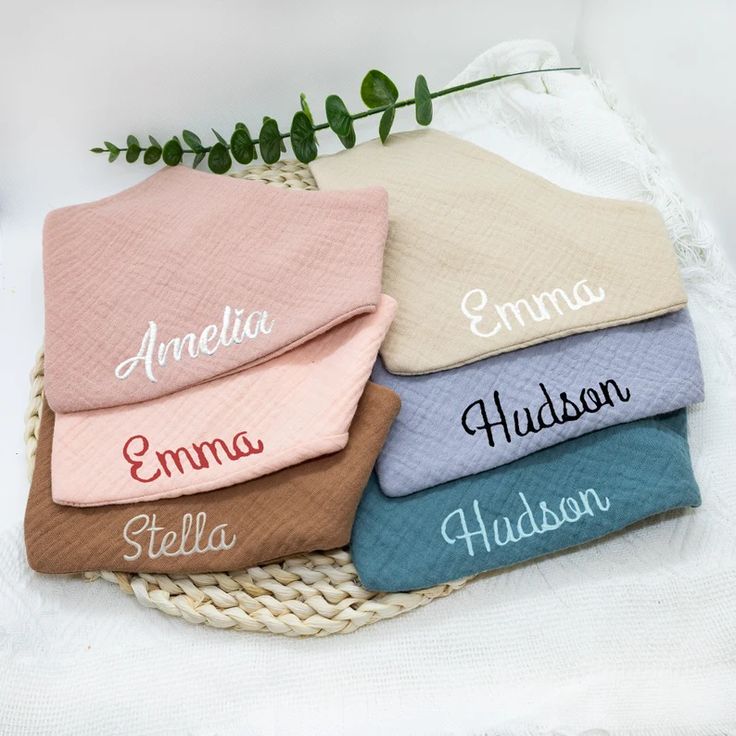 Soft cotton bibs with custom baby names in script
