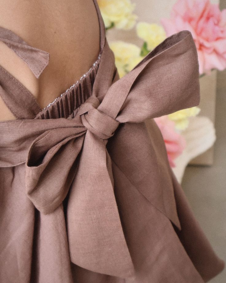 Toddler wearing a chocolate brown party dress